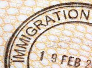Immigration entry stamp on the inside page of a passport (XL)