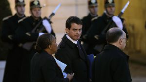 French Prime Minister Valls, Justice minister Taubira and Interior minister Cazeneuve speak together after a meeting at the Elysee Palace in Paris