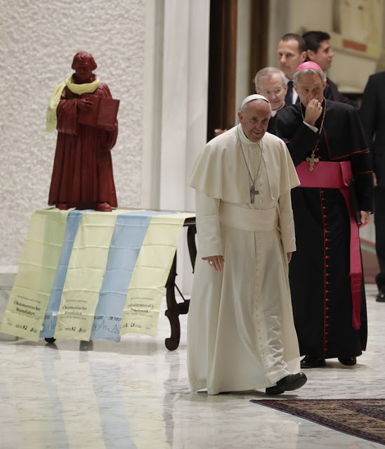 Pope Francis arrives for an audience with Lutheran pilgrims in the Paul VI Hall at the Vatican, Thursday, Oct. 13, 2016. (AP Photo/Alessandra Tarantino)